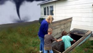 Family going into cellar to avoid Tornado. (Photo By Education Images/UIG via Getty images)
